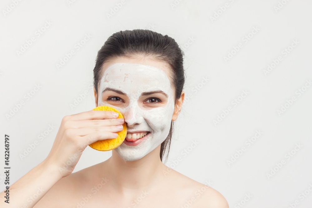 cheerful woman with yellow sponge, white mask cheerful woman with yellow sponge, white mask