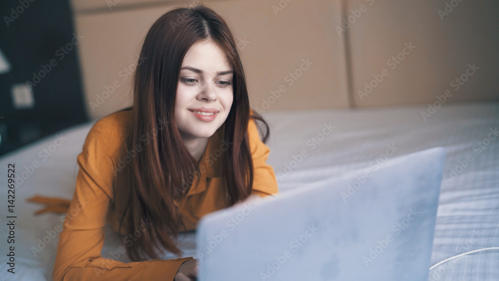woman looking at laptop, working on internet