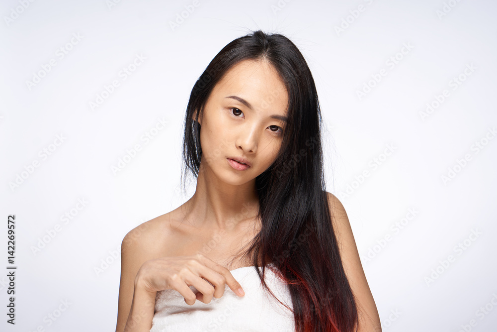 woman with dark hair and in a white towel woman with dark hair and in a white towel