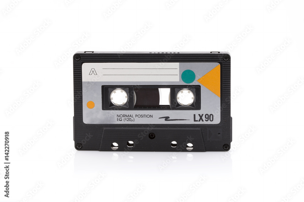 Vintage black compact cassette on white background