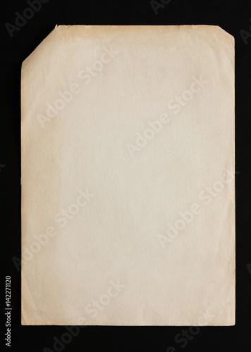 old craft paper sheets pile isolated on black background