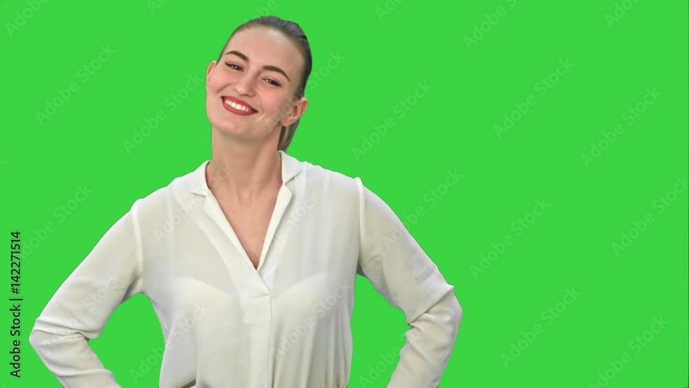 Young pretty businsswoman throws paper document pages on a Green Screen, Chroma Key. Young pretty businsswoman throws paper document pages on a Green Screen, Chroma Key.