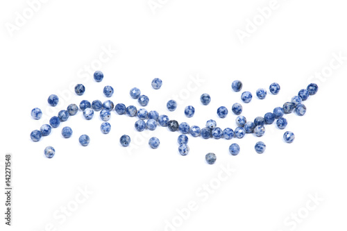 Faceted round beads of blue and white sodalite from Africa isolated on white background