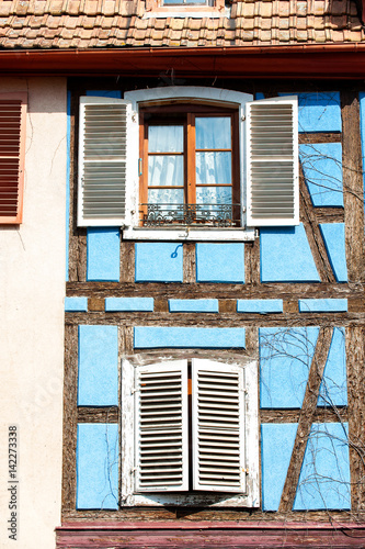 French provencal style blue house with windows. Alsace, France.