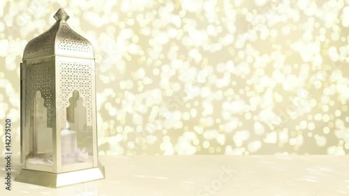 Arabic ornamental lantern with burning candle and glittering golden background with falling bokeh lights. Ramadan HD footage.