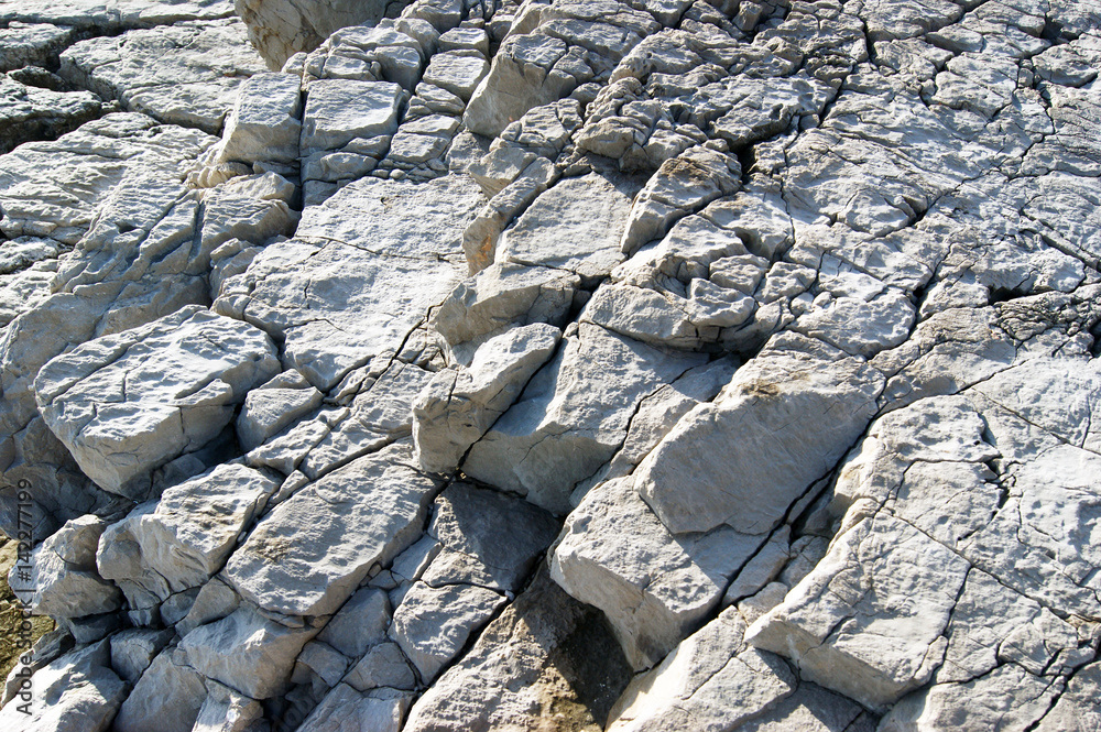 Gray cracked rocks, located in levels