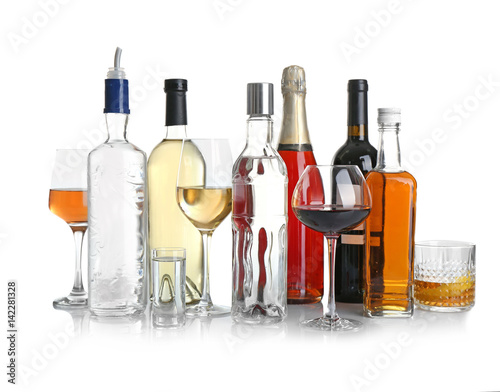 Billede på lærred Different bottles of wine and spirits on white background