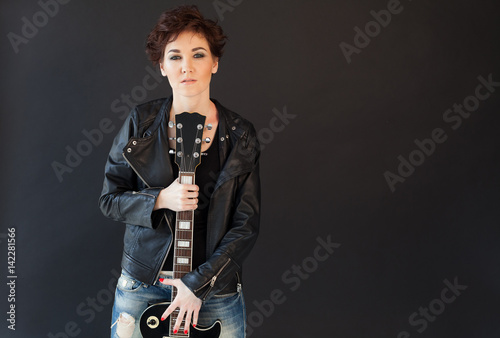 girl with short hair in leather jacket