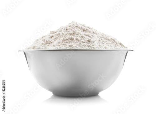 Bowl with flour on white background