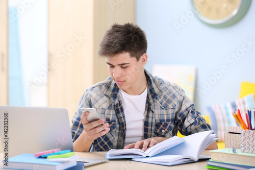 Teenager with phone in hand...