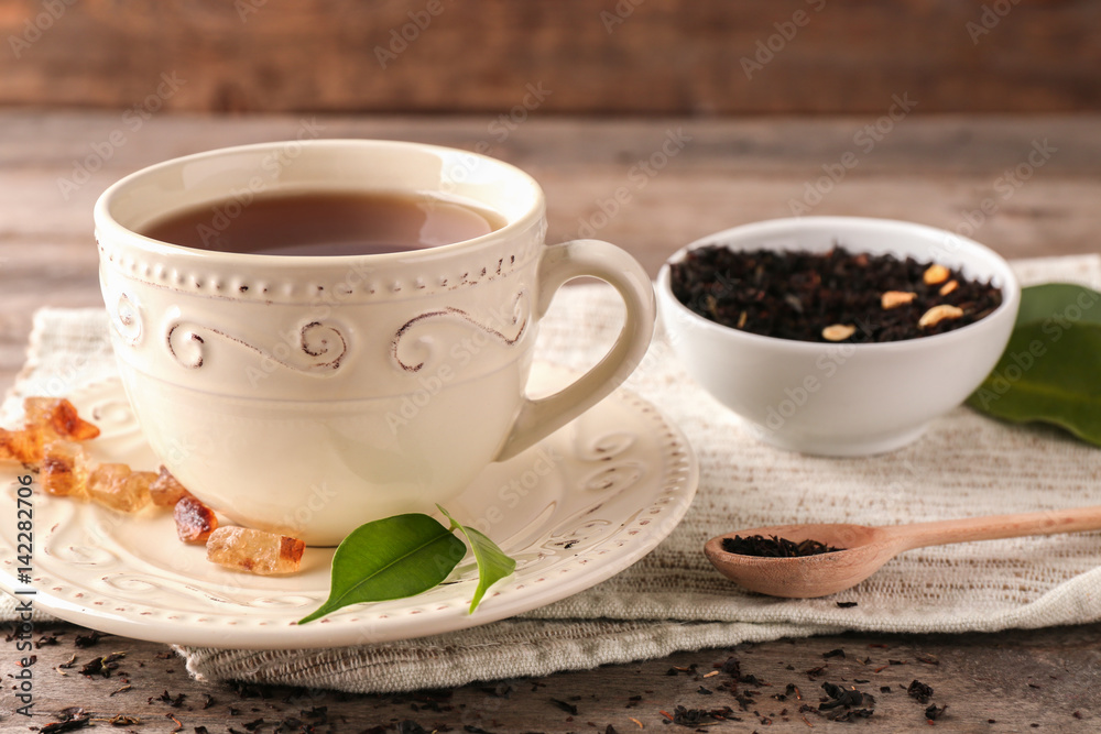 Cup of aromatic tea on napkin Cup of aromatic tea on napkin