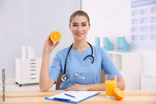 Young female nutritionist i...