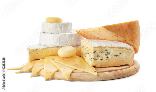 Wooden board with tasty cheese on white background photo