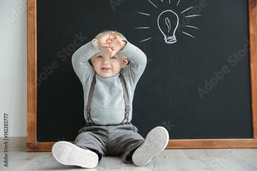 Cute little boy sitting on ...
