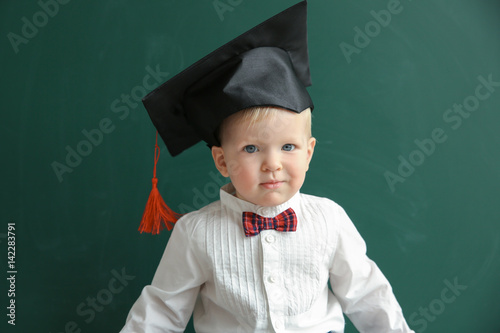 Cute little boy with magist...