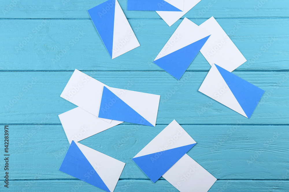Blank paper cards for branding on blue wooden background Blank paper cards for branding on blue wooden background