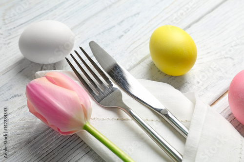 Beautiful Easter table setting on wooden table