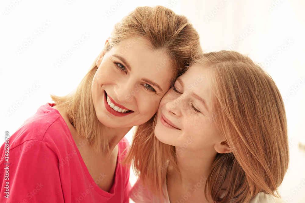 Happy mother and daughter on light background Happy mother and daughter on light background