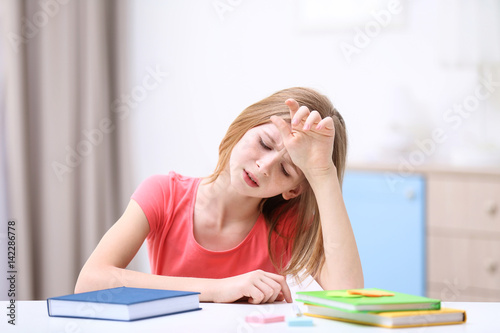 Cute girl suffering from he...