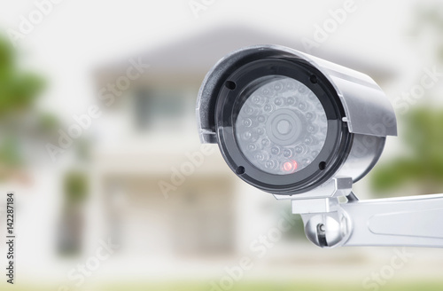 CCTV camera ccd lens security  on house home blure background
