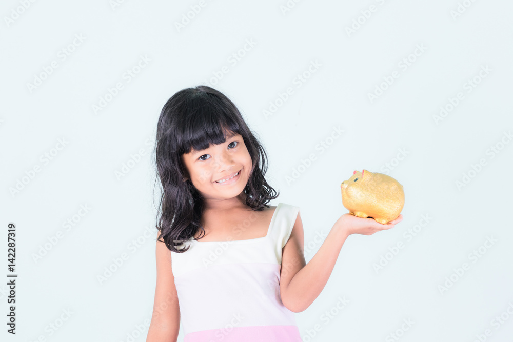 Young girl holding piggy bank on white background.saving money concept. Young girl holding piggy bank on white background.saving money concept.
