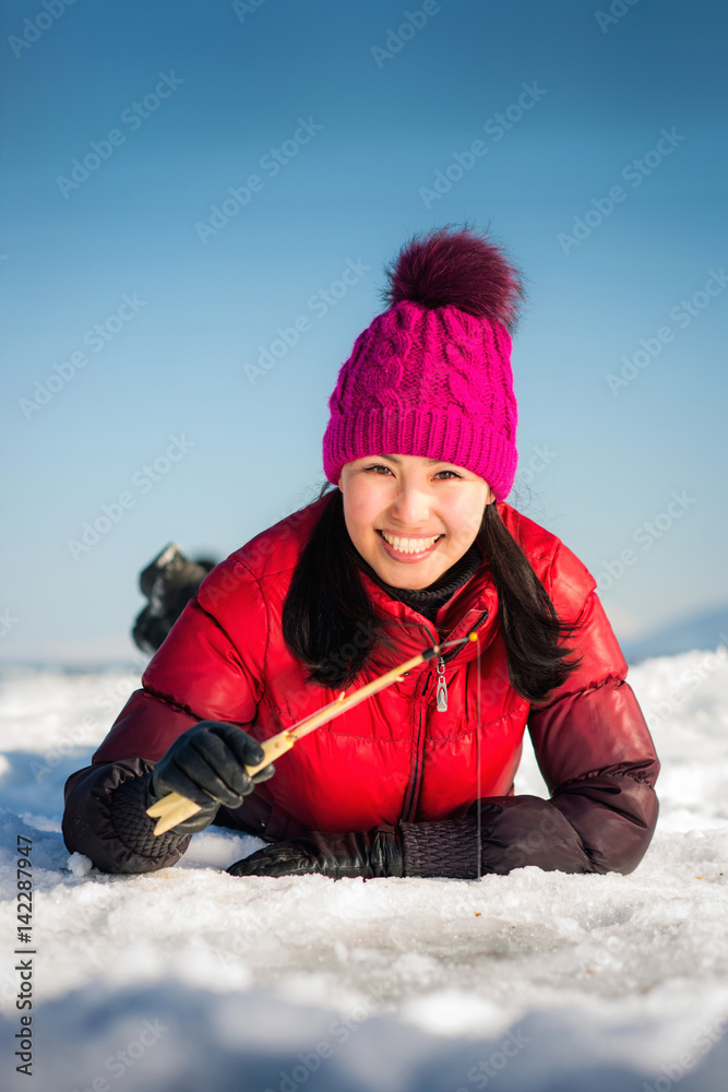 Woman Ice fishing In The Winter Stock Adobe Stock woman-ice-fishing-in-the-winter-stock-adobe-stock