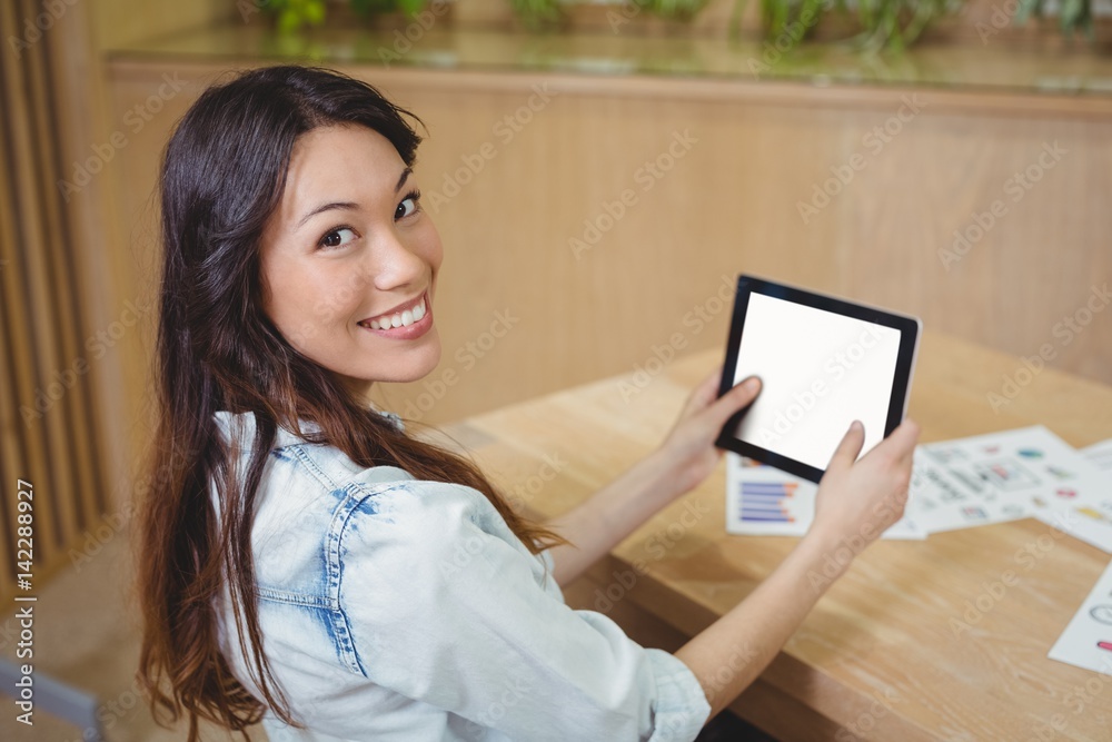 Portrait of female business executive using tablet Portrait of female business executive using tablet