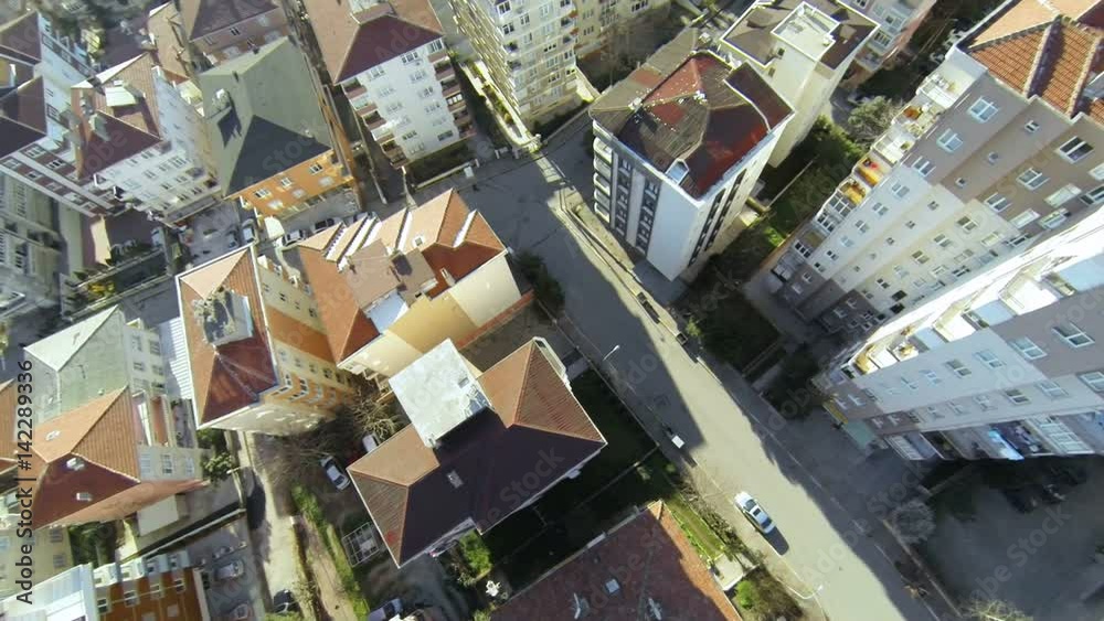 Top down city blocks. Flying over streets and houses along suburban architecture in Istanbul. Aerial video of rooftops from flying camera Top down city blocks. Flying over streets and houses along suburban architecture in Istanbul. Aerial video of rooftops from flying camera