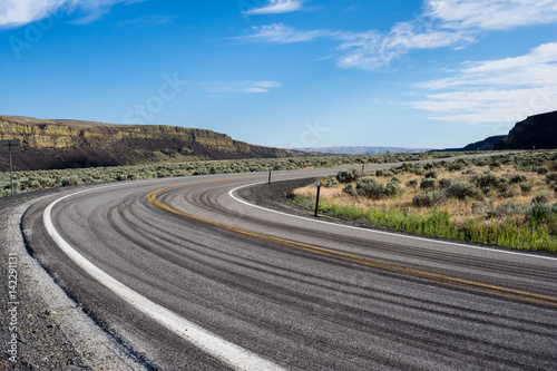 Empty road running through desert in Eastern Washington state, USA