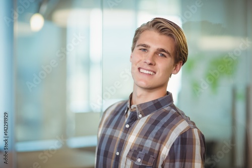 Smiling business executive in office © WavebreakMediaMicro