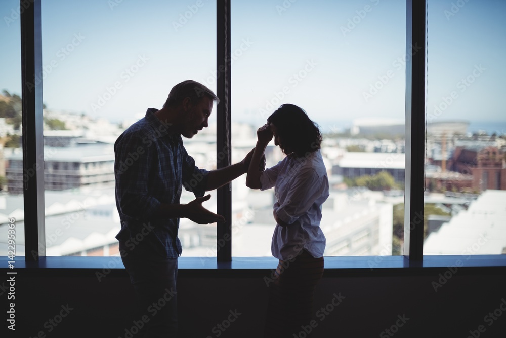 Fototapeta premium Business couple arguing near the window