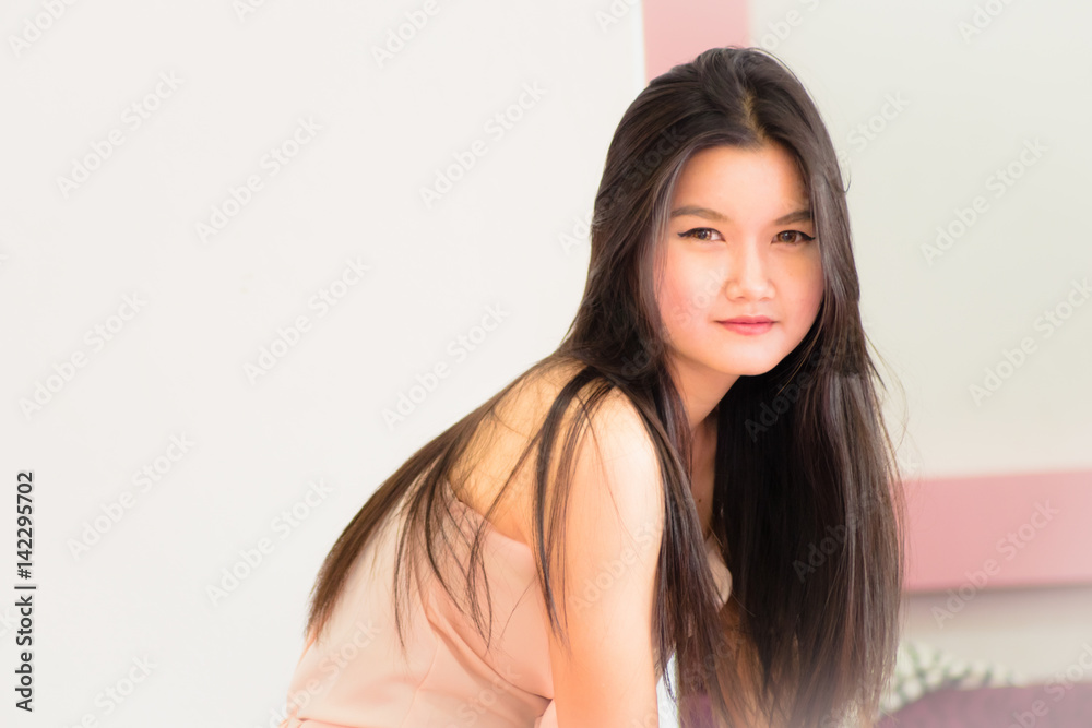 Asian girl.Portrait of beautiful young girl with clean skin on pretty face - white background Asian girl.Portrait of beautiful young girl with clean skin on pretty face - white background