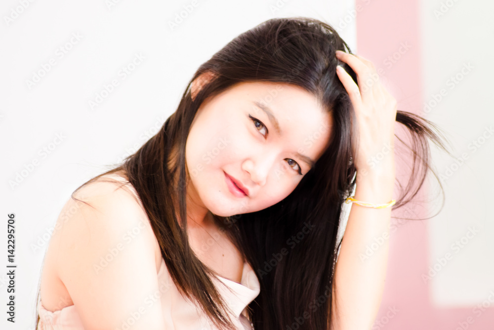 Asian girl.Portrait of beautiful young girl with clean skin on pretty face - white background Asian girl.Portrait of beautiful young girl with clean skin on pretty face - white background