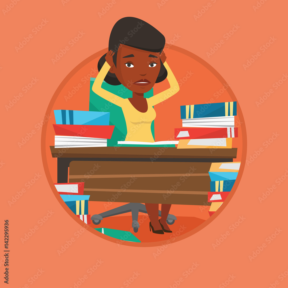 Student sitting at the table with piles of books. Student sitting at the table with piles of books.