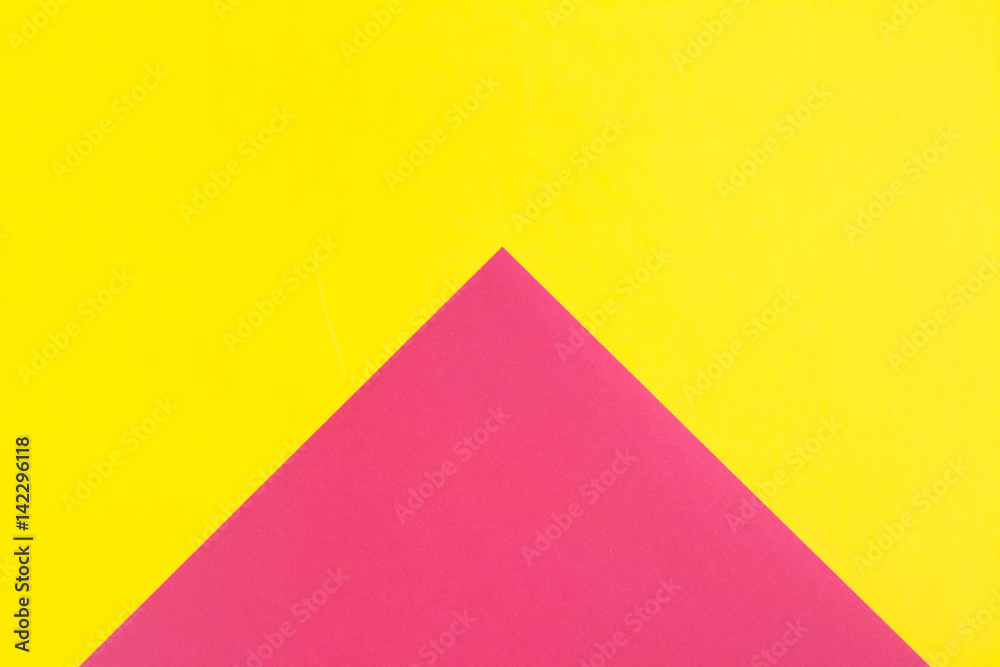 Flat composition. Pink and yellow colors. Large arrow
