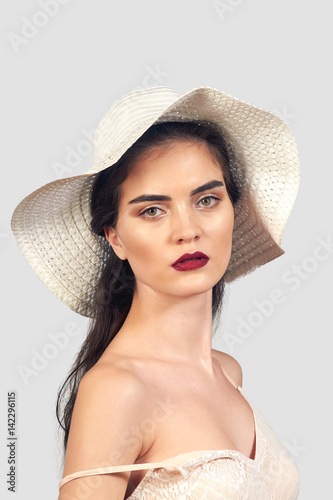 stylish portrait of a girl in hat , close-up