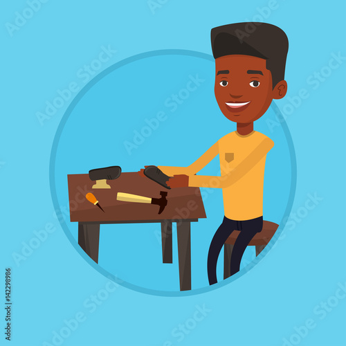 Shoemaker making handmade shoes in workshop.