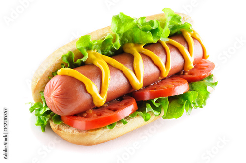 Hotdog with big sausage and fresh tomato isolated on white background photo