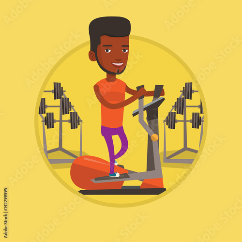 Man exercising on elliptical trainer.