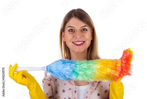 Vászonkép Attractive female housekeeper holding a flannel
