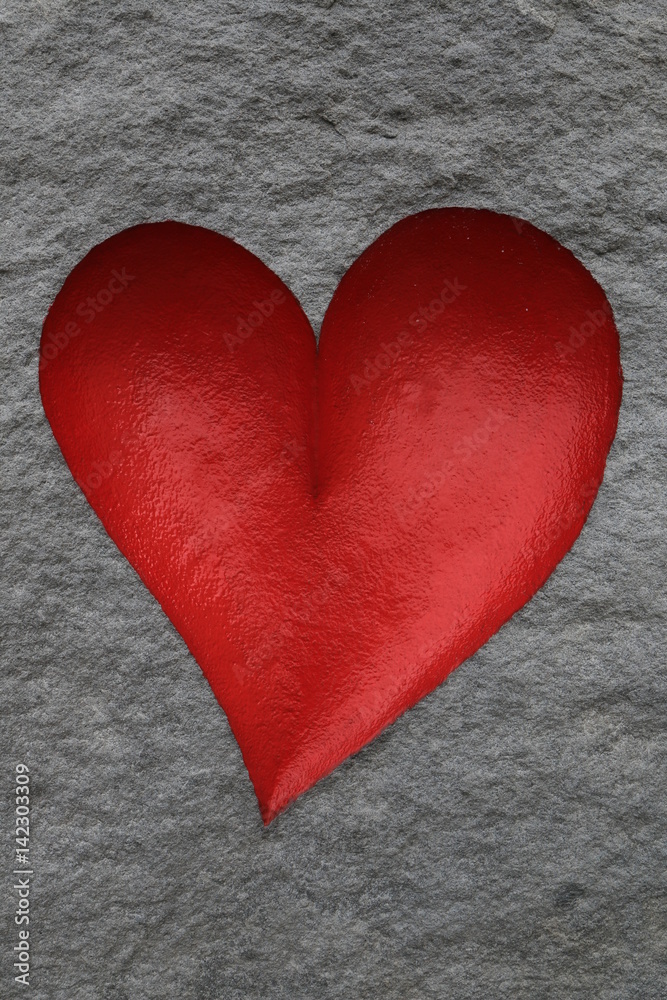 rotes Herz in Stein StockFoto Adobe Stock