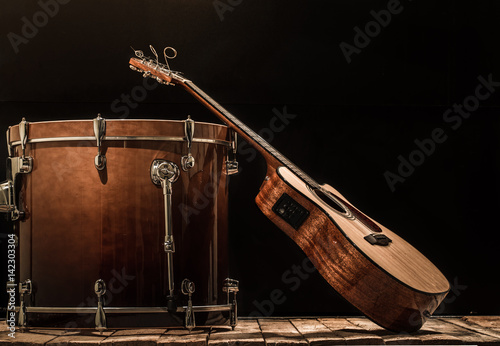 Canvas Print musical instruments, drum bass and acoustic guitar on a black background
