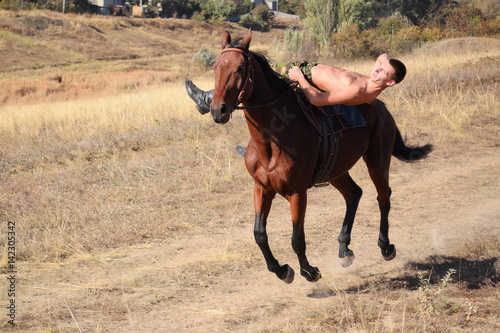 The guy is riding a horse