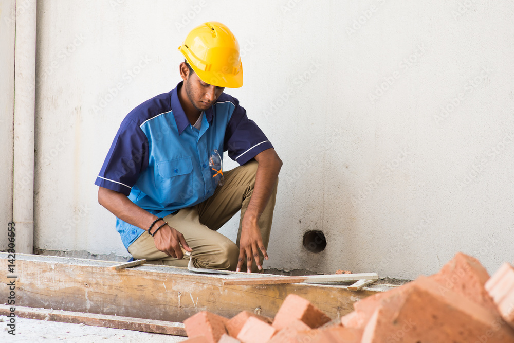 indian contruction working doing mansonary