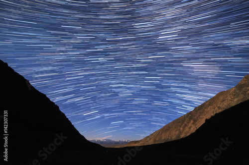 Traces of stars in the form of lines. View in the mountains. Kyrgyzstan photo