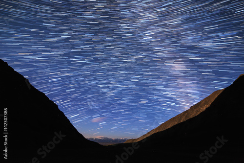 Traces of stars in the form of lines. View in the mountains. Kyrgyzstan photo