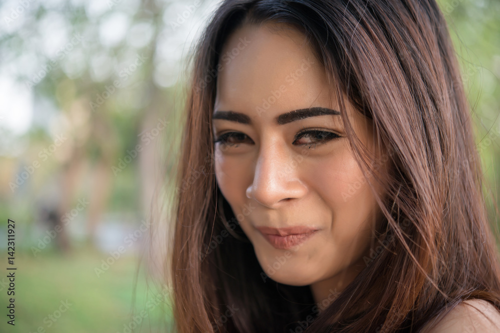 Portrait of a smiling girl relaxing in nature park outdoors. Portrait of a smiling girl relaxing in nature park outdoors.