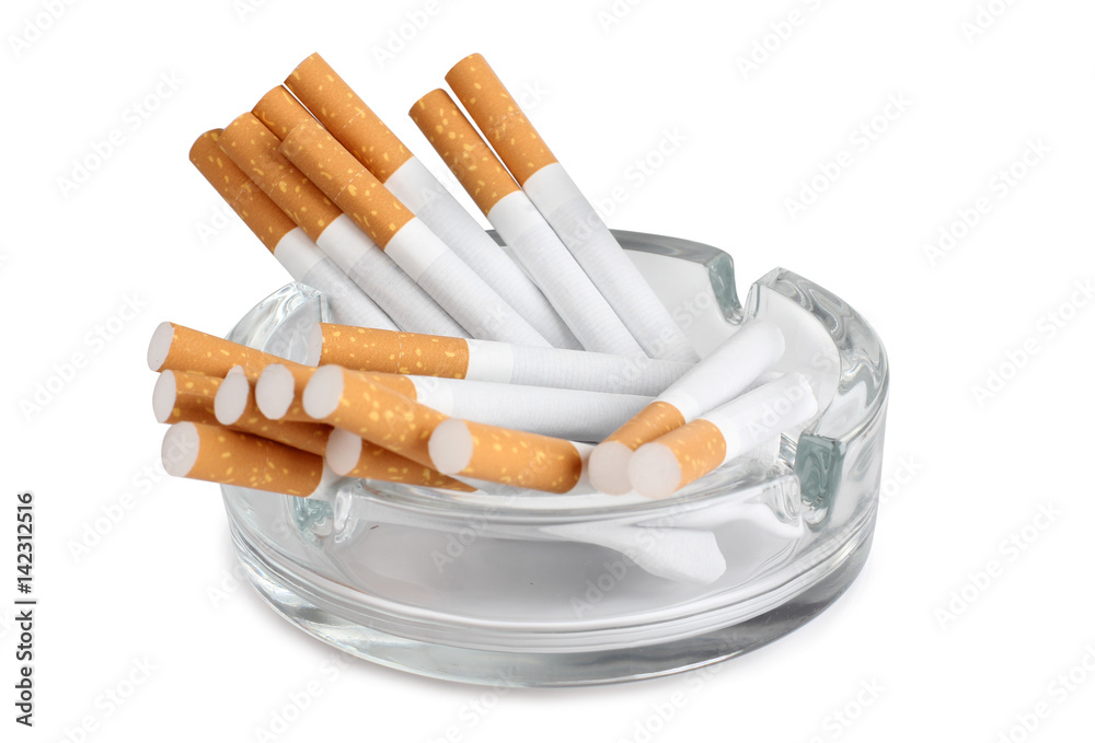 Glass ashtray and cigarette on white background Glass ashtray and cigarette on white background