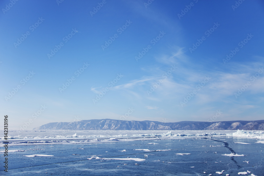 Lake Baikal ice near Listvyanka village. Winter landscape Lake Baikal ice near Listvyanka village. Winter landscape