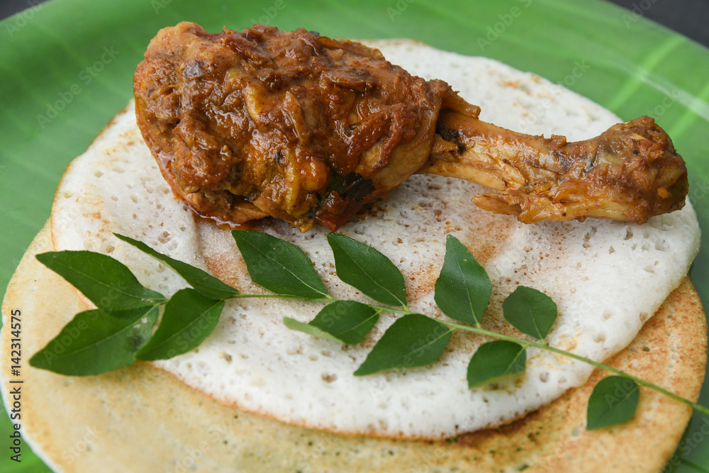 Dosa and Coconut chutney with fresh raw coconut cut in half with